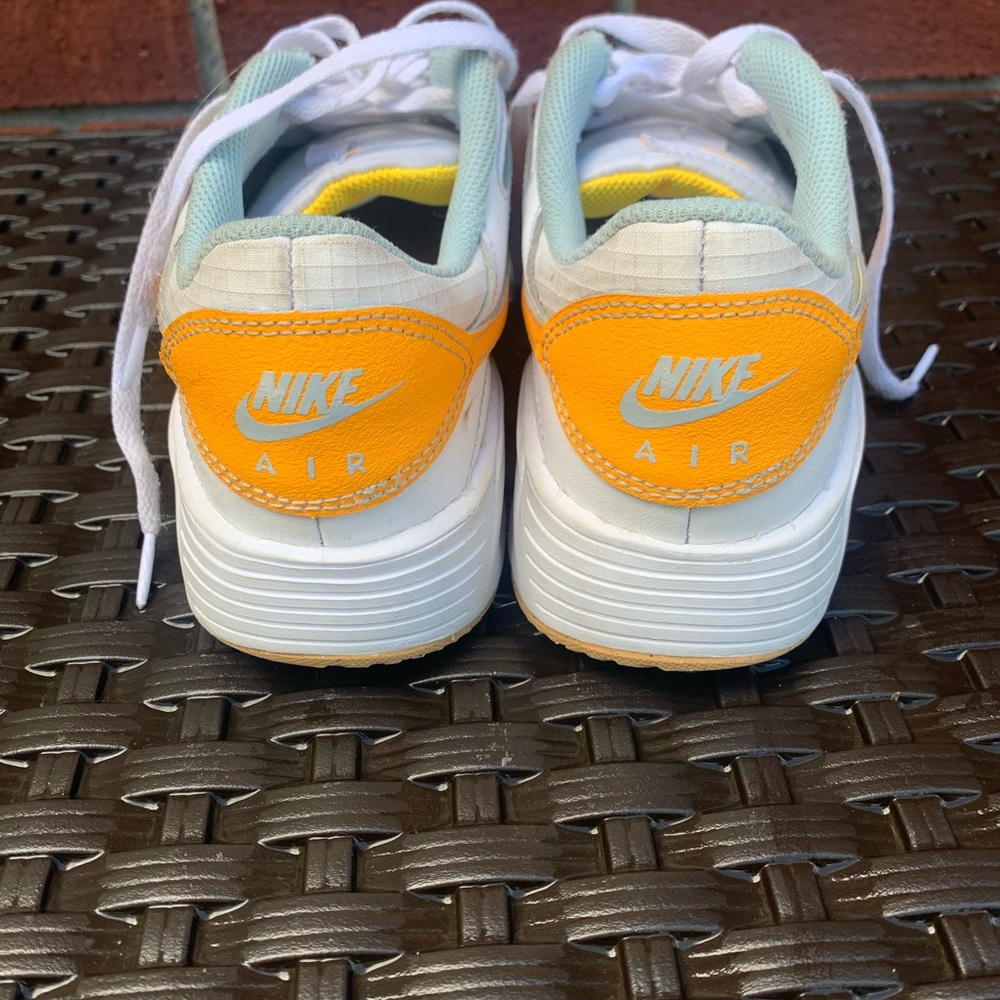 Men’s Nike shoes, Gold and light blue accents. Size 7.5